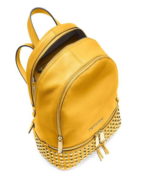 yellow Michael Kors backpack